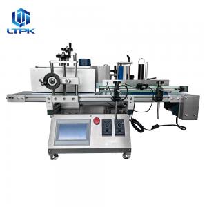 Bench top round bottle laebler conveyor belt in opposite direction