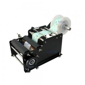 Manual low cost round bottle labeling machine
